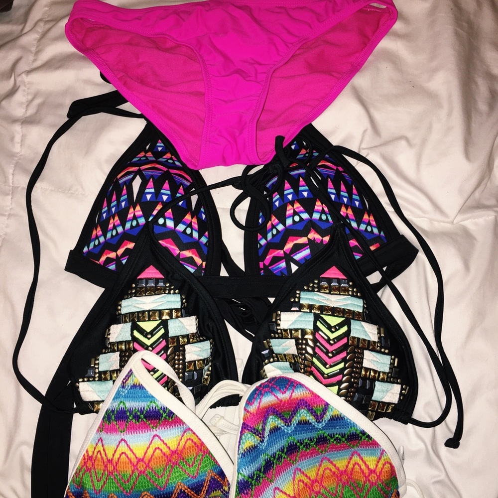 3 swim tops and one pink bottom